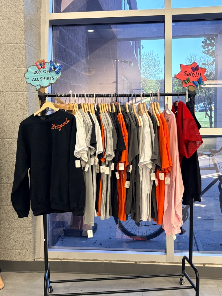 Image of a clothing rack with a variety of Bengals t-shirts and sweatshirts available for purchase. 