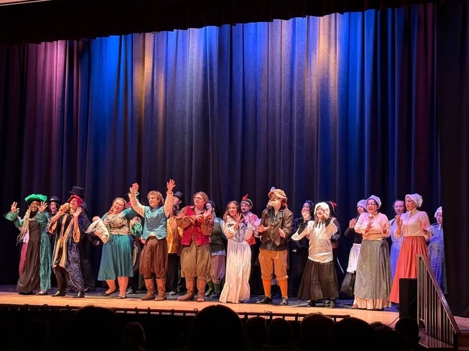 Image of the cast of Something Rotten performing a scene on stage in costume. 