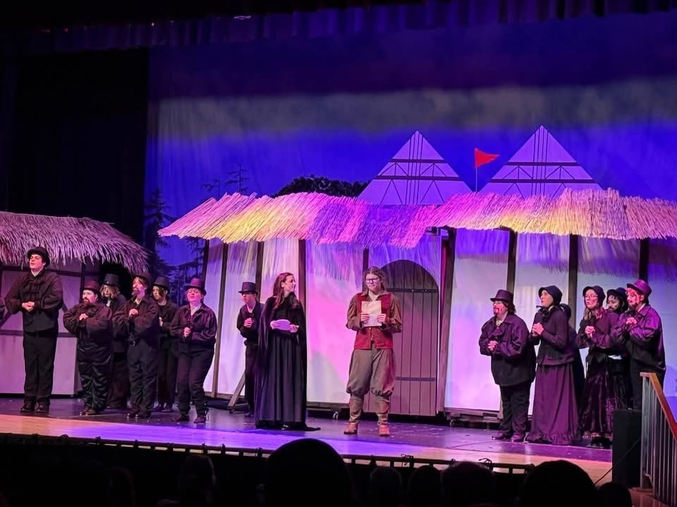 Image of the cast of Something Rotten performing a scene on stage in costume. 