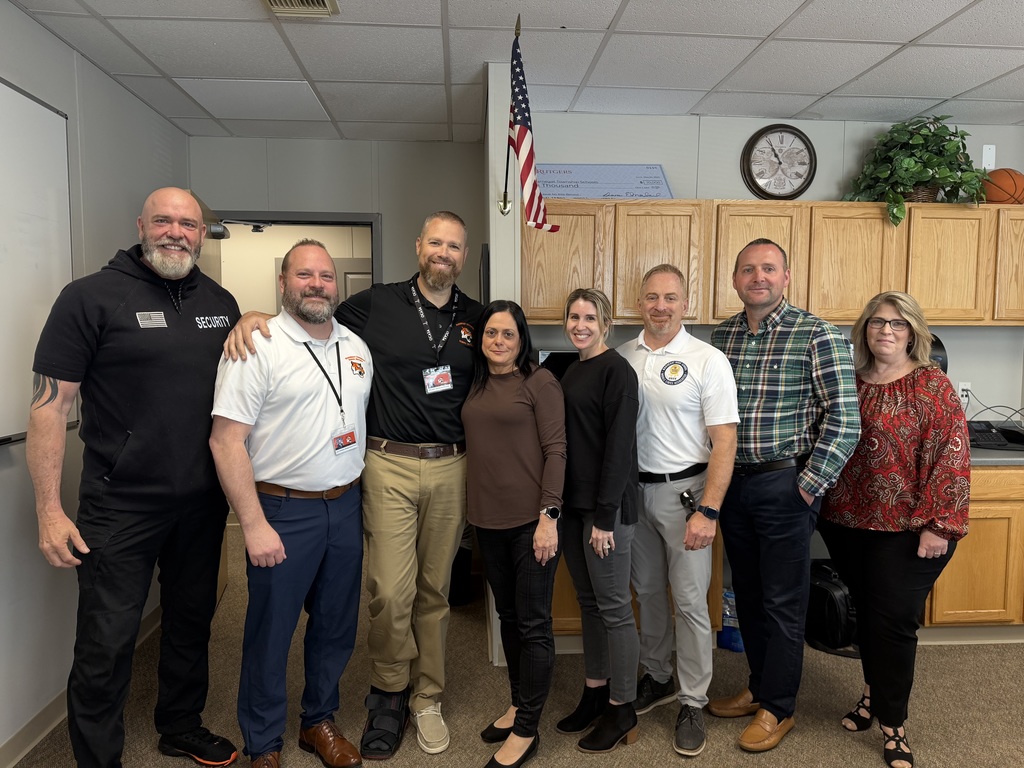 Image of Jennifer posing with the Superintendent, district and building administrators. 