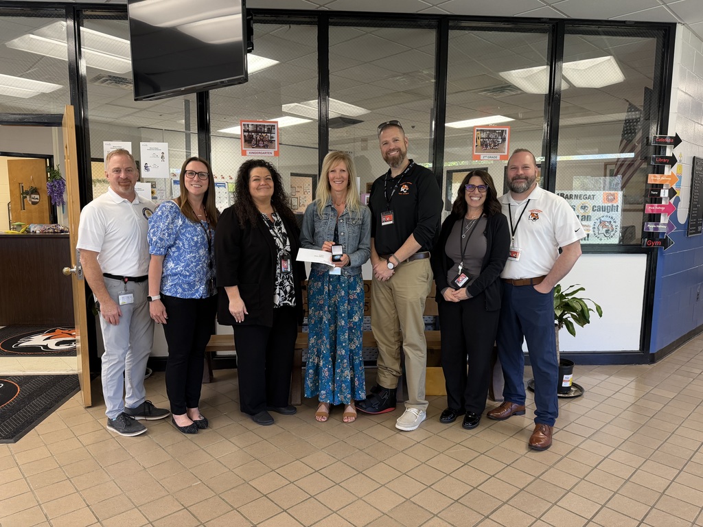 Image of Kristen posing with the Superintendent, district and building administrators.