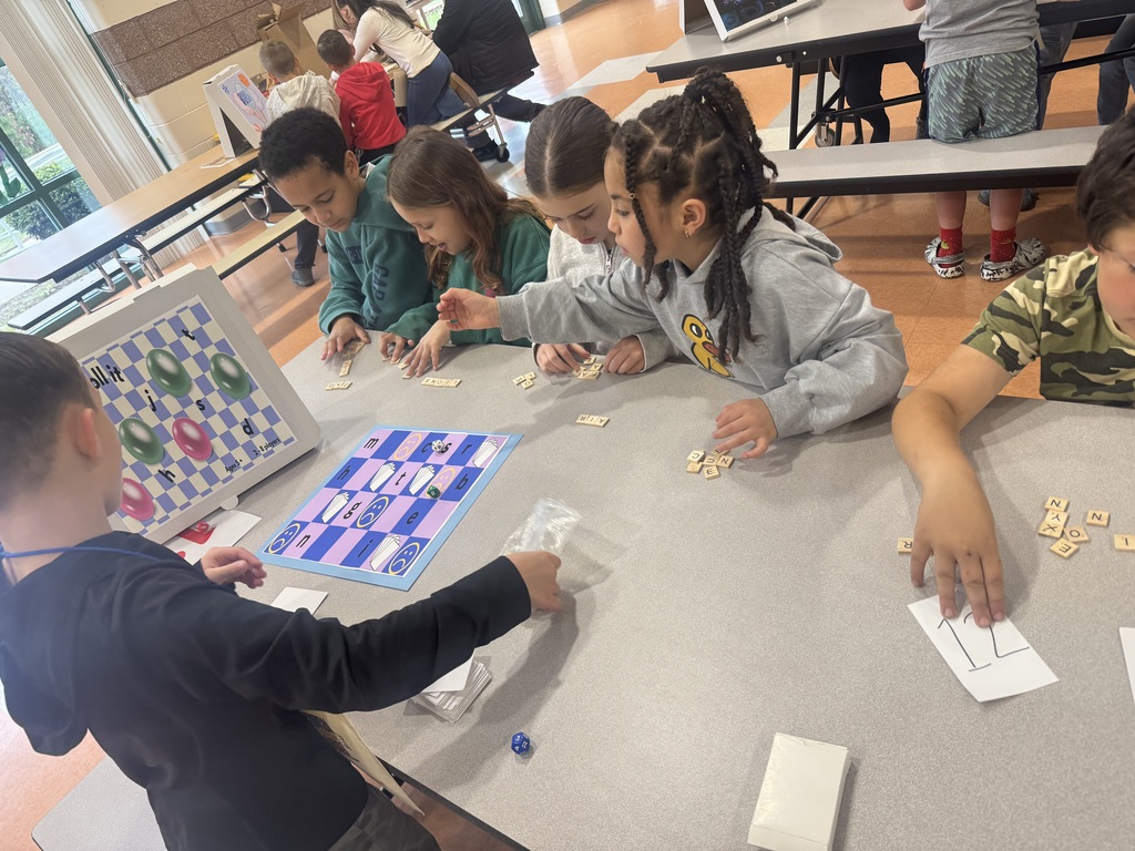 Image of 3rd grade students playing a game that one of the G&T students made. 