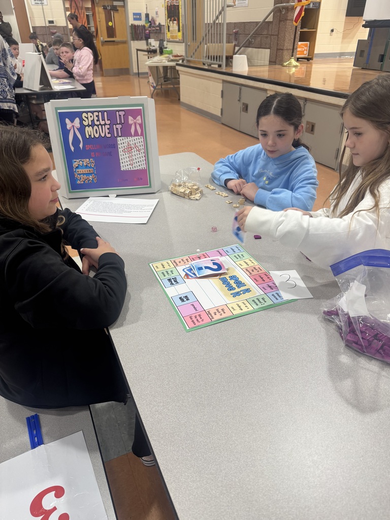Image of 3rd grade students playing a game that one of the G&T students made. 