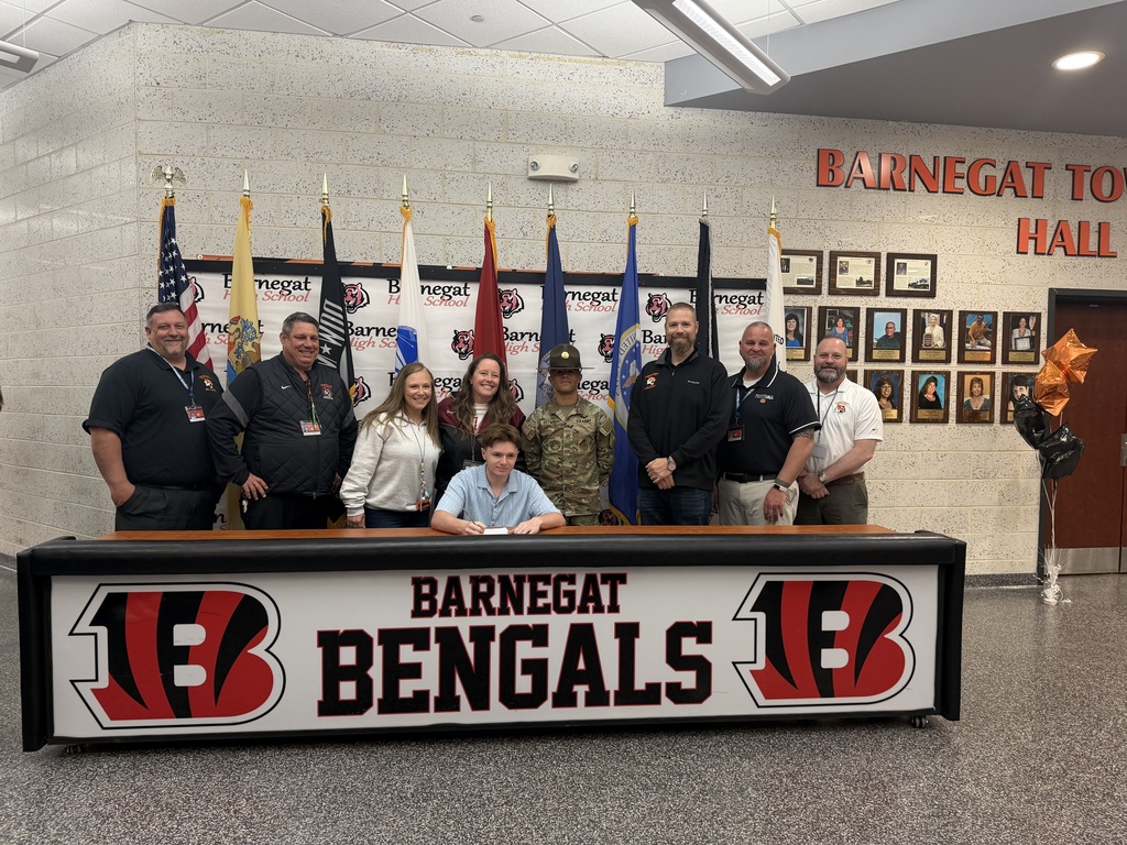 Image of Charles posing with the Superintendent, district & building administrators, school counselor, and recruiter. 