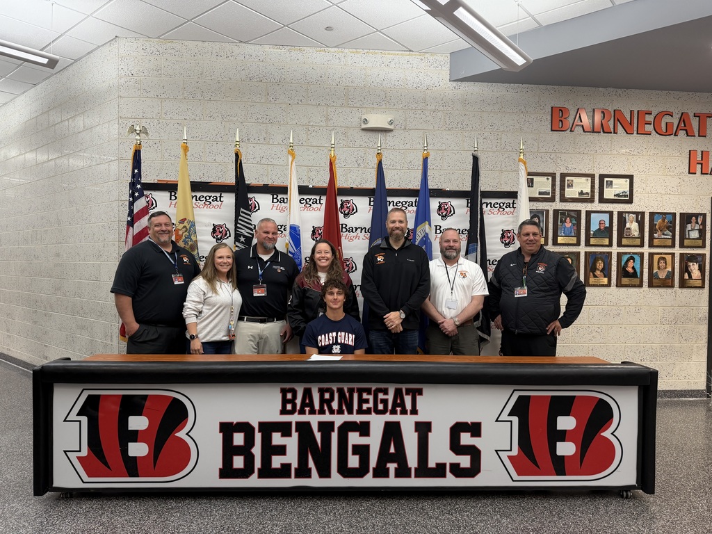 Image of Dylan posing with the Superintendent, district & building administrators, and school counselor. 