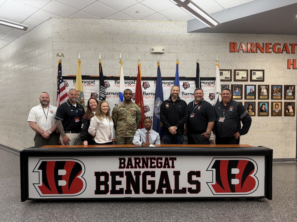 Image of Nazir posing with the Superintendent, district & building administrators, school counselor, and recruiter. 