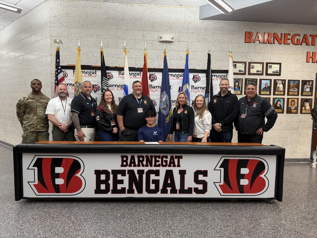 Image of Jorge posing with the Superintendent, district & building administrators, school counselor, and recruiter. 
