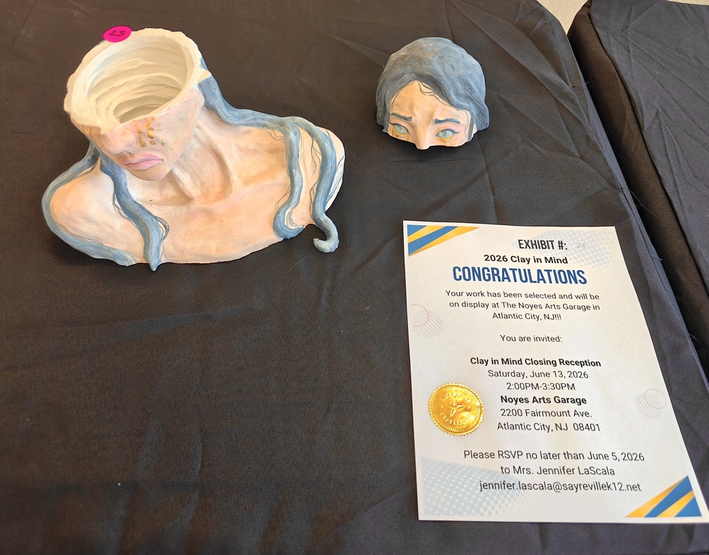 Image of the ceramic sculpture, a woman's face, long hair, neck and shoulders who's head is severed  from the bridge of the nose up. 