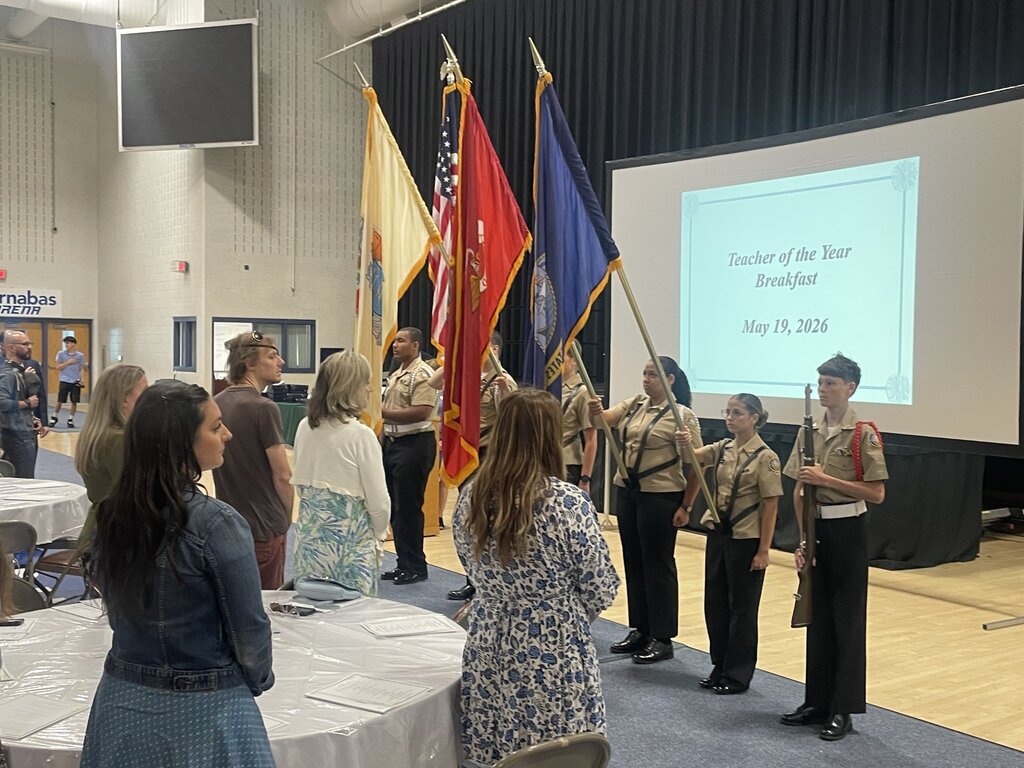 Image of the NJROTC members presenting colors at the arena. 