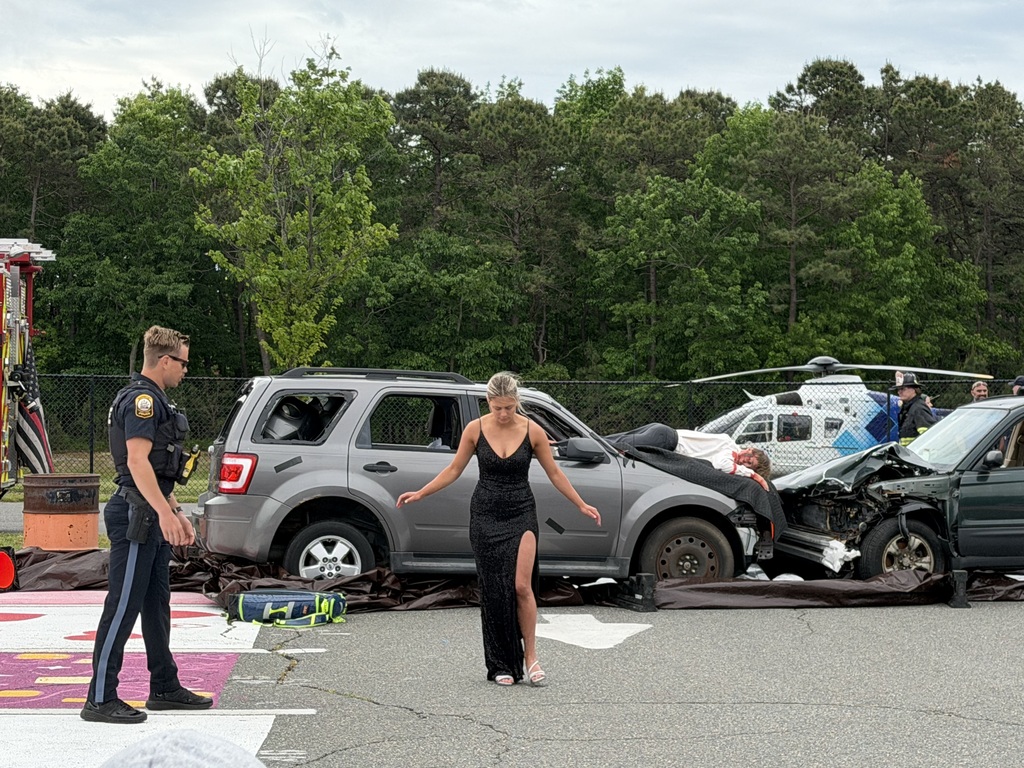 Image of the student actor who was driving going through a sobriety test with a police officer.