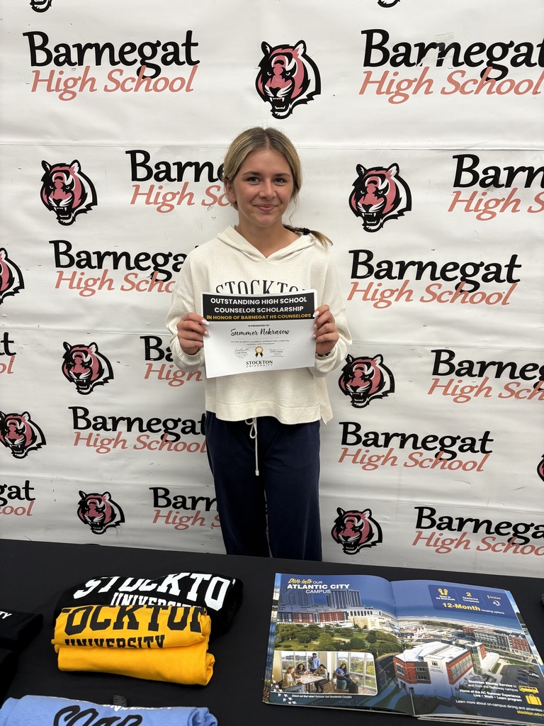 Image of Summer holding a certificate that says Outstanding High School Counselor Scholarship and her name.