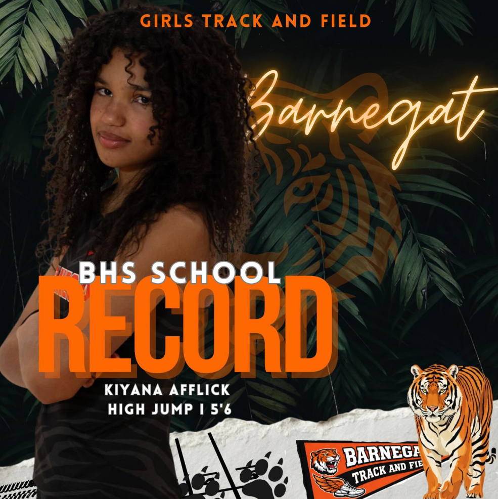 Image of Kiyana posing with her arms across her chest that says girls track and field, Barnegat, BHS School Record, her name, high jump 5'6  with a bengal tiger and flag in the bottom corner. 