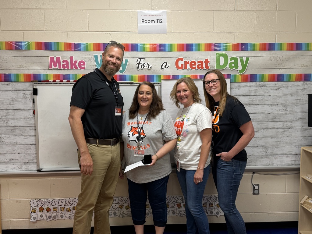 Image of Dawn posing with the Superintendent, Principal, and Supervisor of Special Education. 