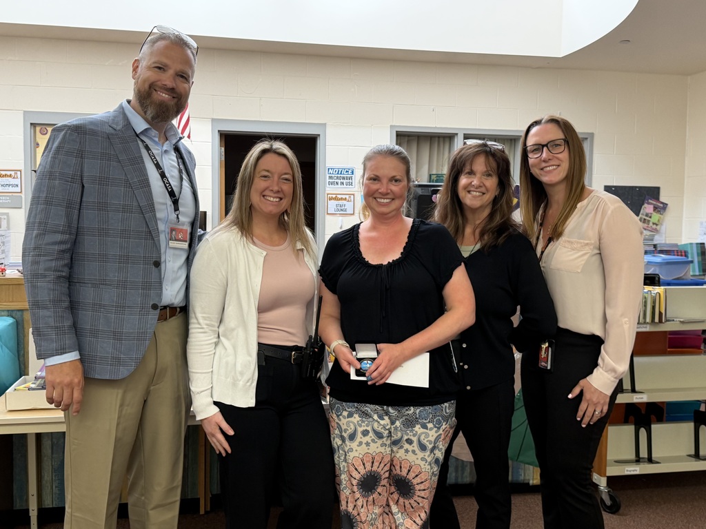 Image of Allison posing with the Superintendent, Principal, Vice Principal, and Supervisor of Special Education.