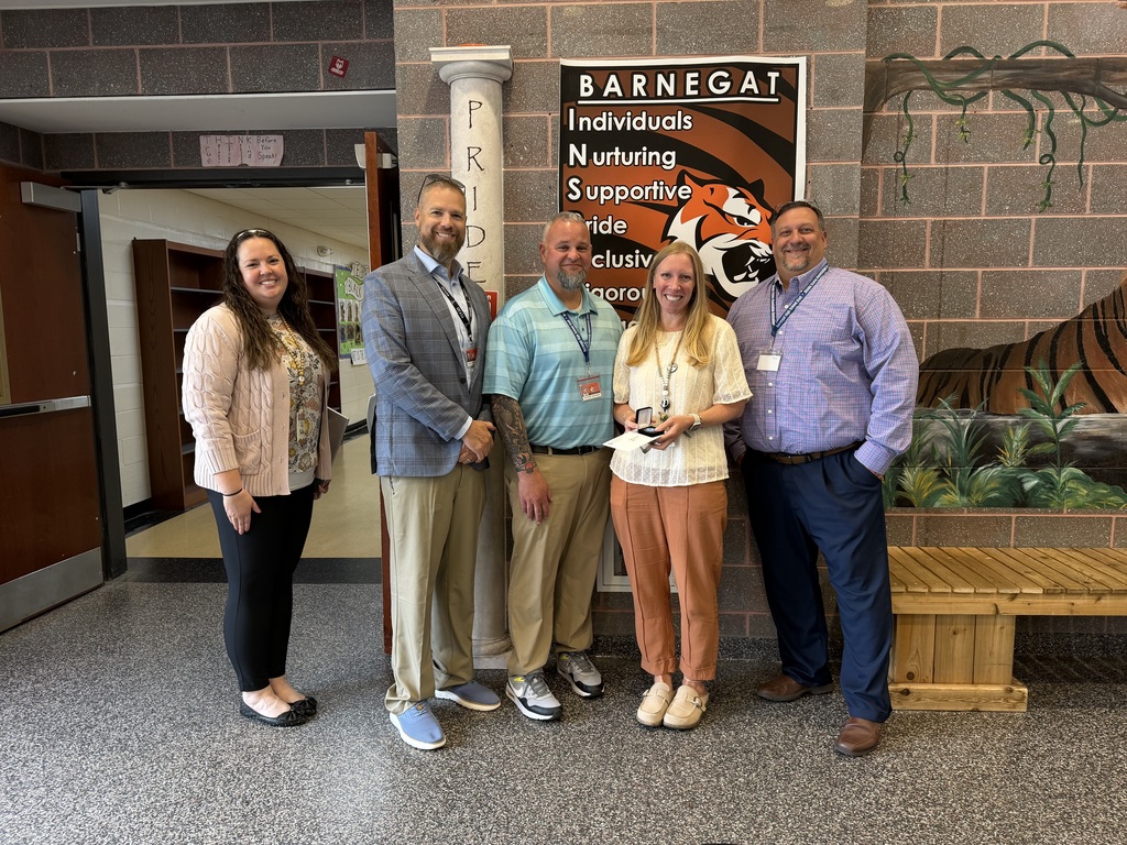 Image of Kate posing with the Superintendent, Principal, Vice Principal, and Supervisor.