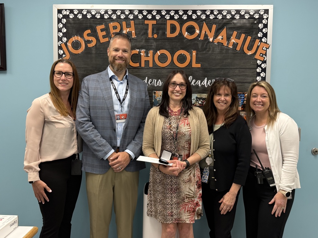 Image of Allison posing with the Superintendent, Principal, Vice Principal, and Supervisor of Special Education.