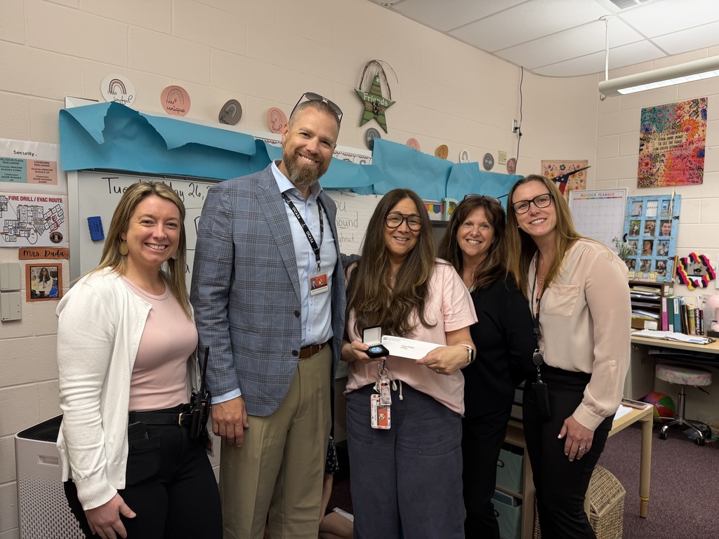 Image of Lisa posing with the Superintendent, Principal, Vice Principal, and Supervisor of Special Education.