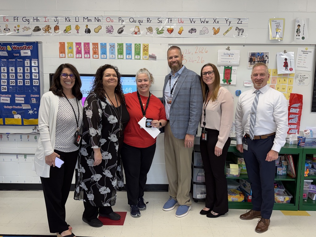 Image of Jennifer posing with the Superintendent, Principal, and district administrators.