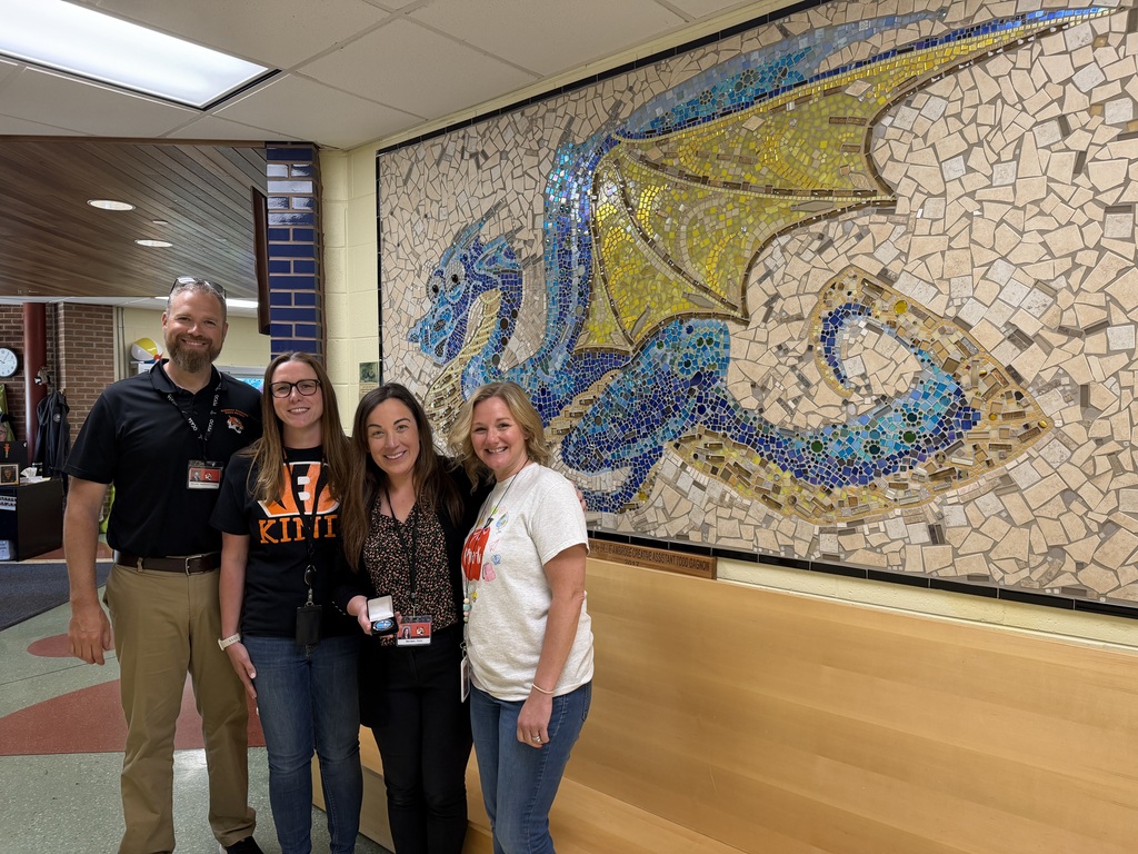 Image of Jillian posing with the Superintendent, Principal, and Supervisor.