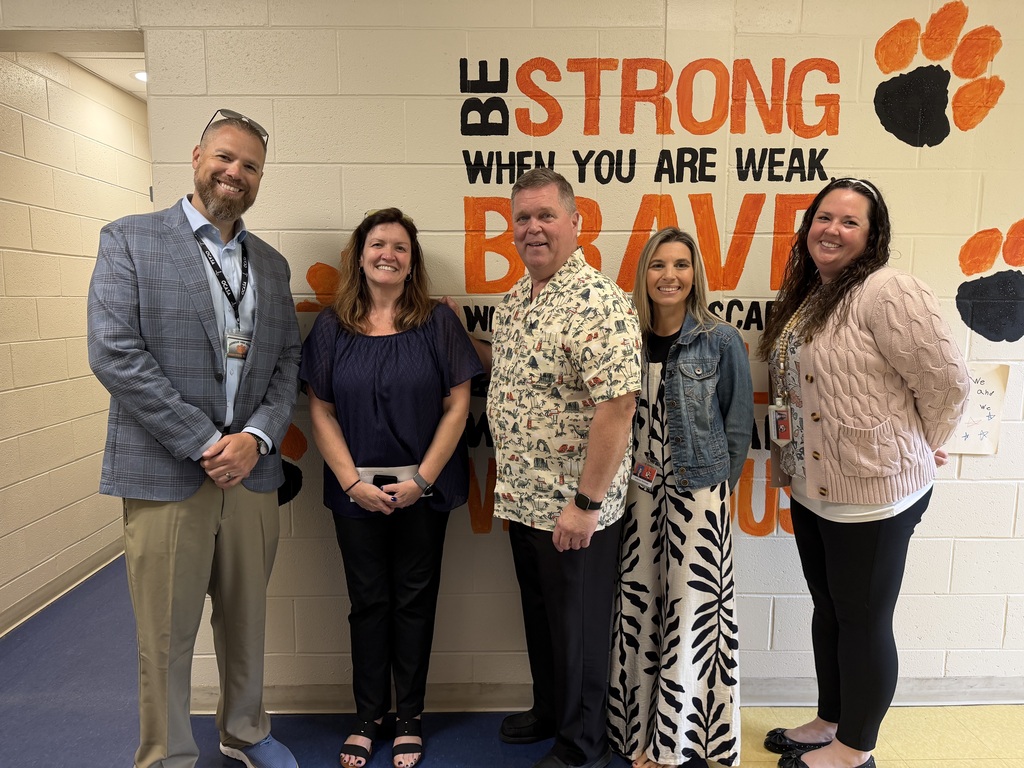 Image of Catherine posing with the Superintendent, Principal, Vice Principal, and Supervisor.