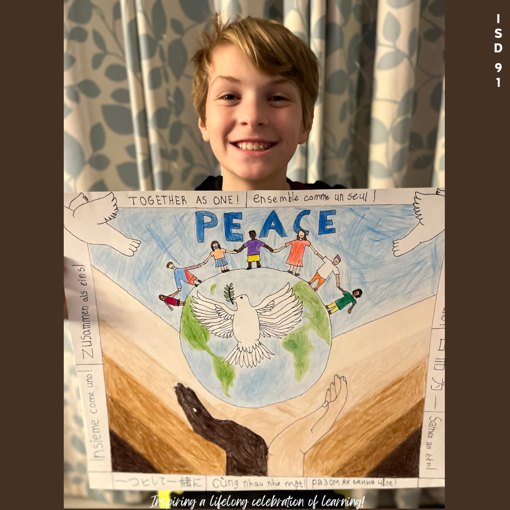 BHS Student displaying his Peace Art Award