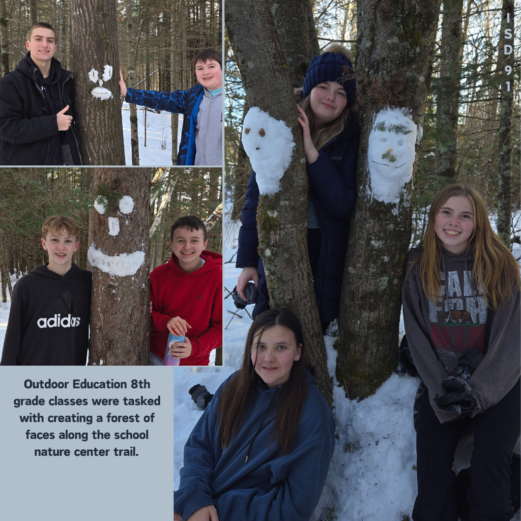 BHS Students creating snow faces on trees in nature center