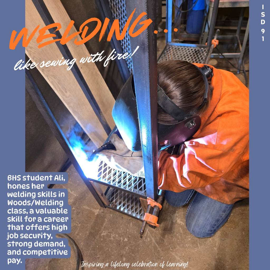 BHS female student in welding gear welding a rack