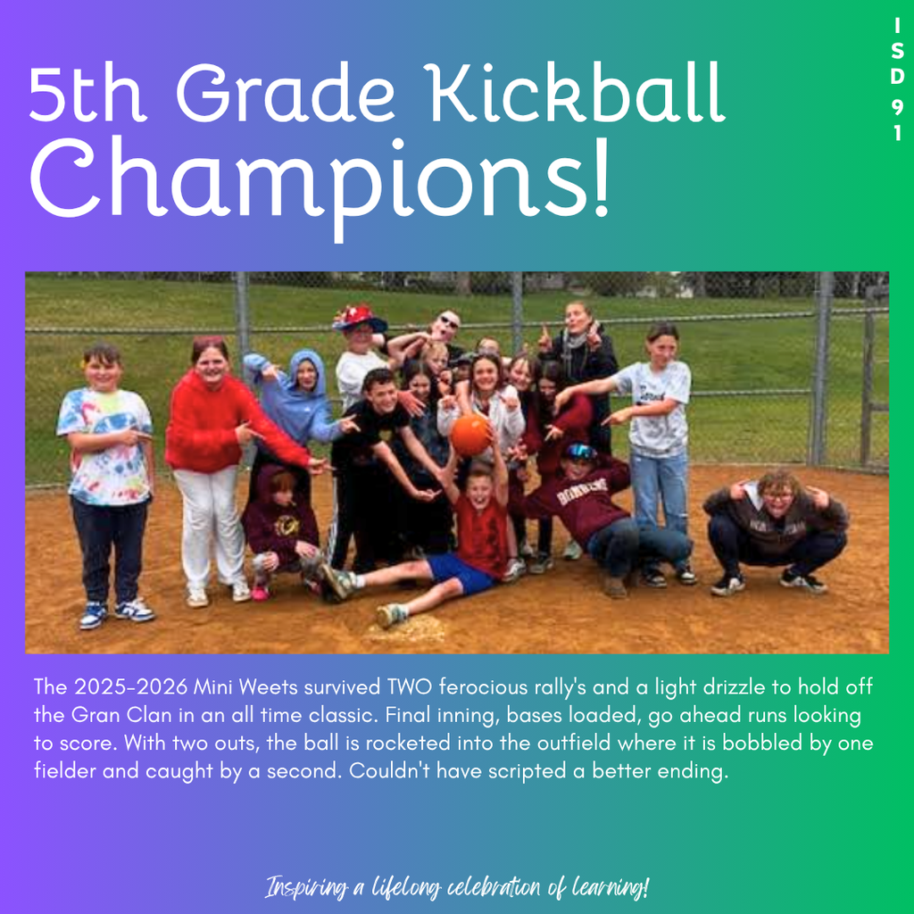 5th grade class standing by home plate cheering and holding up kickball