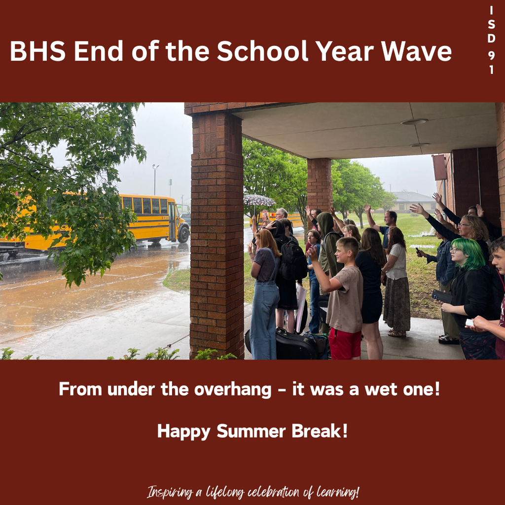 Staff out under the front door overhang waving good-bye to the students as they leave for the summer - in the rain