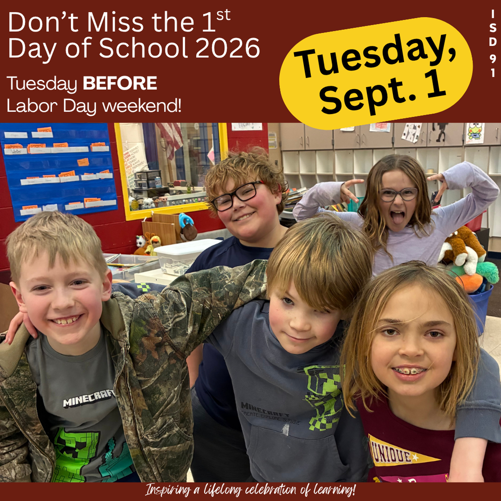 5 elementary aged students in a group smiling at the camera from classroom