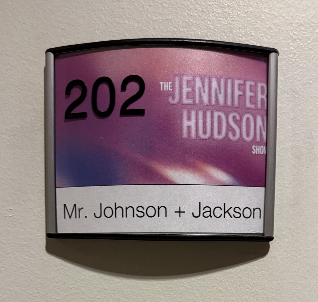 A name plate on the door that includes Mr. Johnson and Jackson
