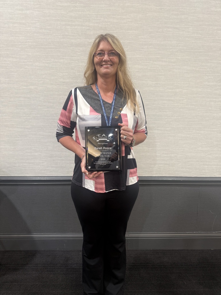 Sarah holding plaque