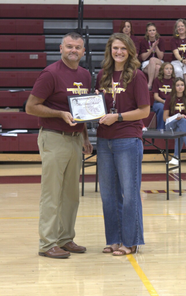 Mrs. Delena Wethington receiving the award from BCMS principal, Mr. Joey Bunch.