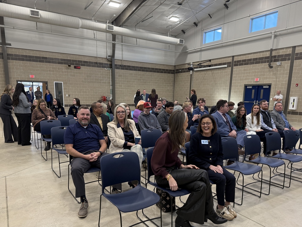 seated crowd in Ag Center