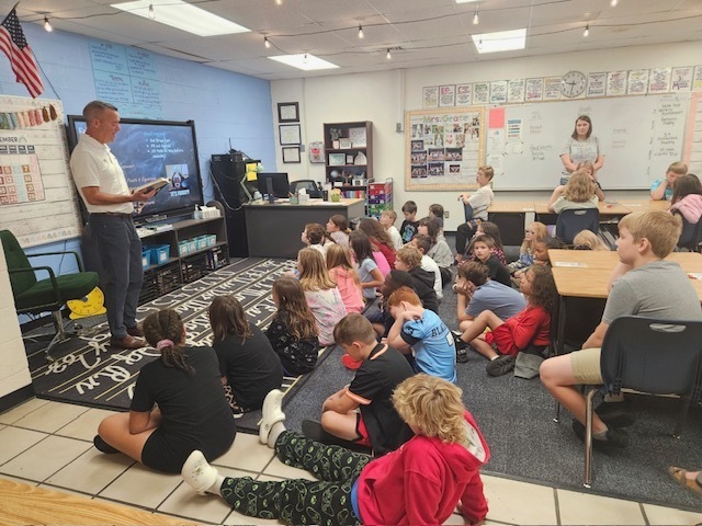 Mr. McCauley reading to 4th grade