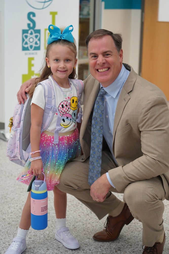 Superintendent Terza with first grade student