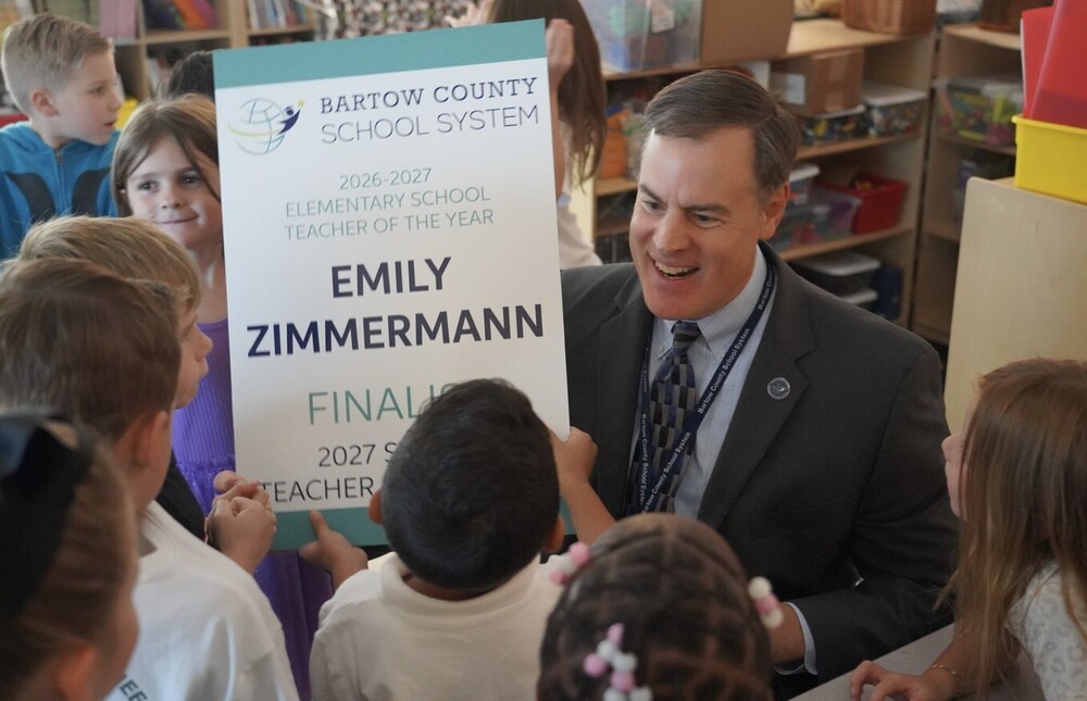 Superintendent Terza with students