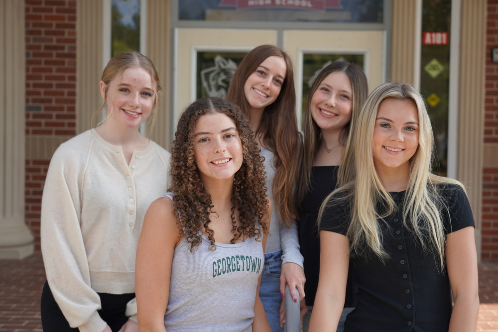 Woodland High School students posing for an award