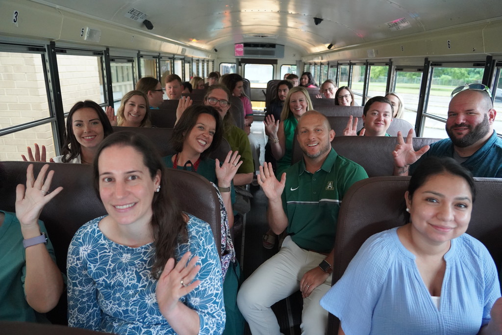 new teachers riding on a school bus