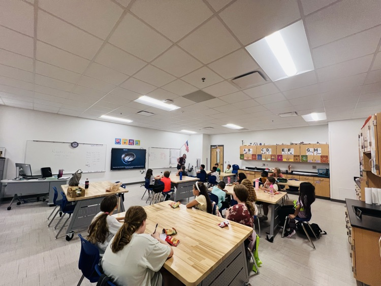 classroom of students watching a video 