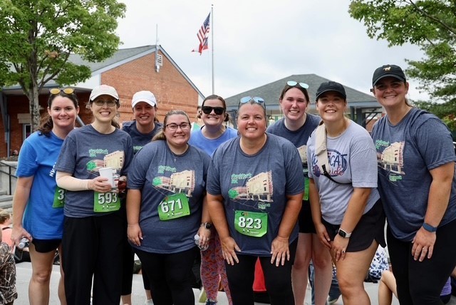 Group of MRES teacher smiling for a picture at the 5K
