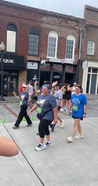 Teachers walking towards the finish line