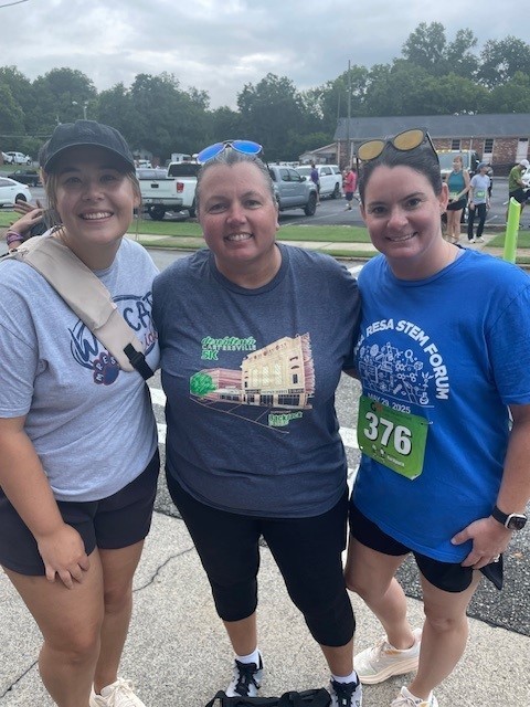 Third grade teachers smiling for a picture at the 5K
