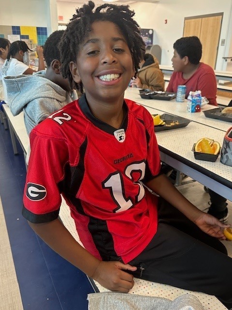 Students smiling for a picture on spirit day.
