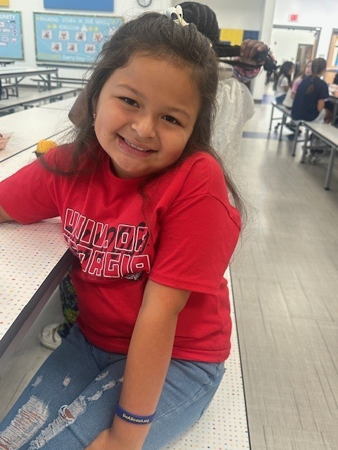 First grade students smiling for a picture of spirit day.