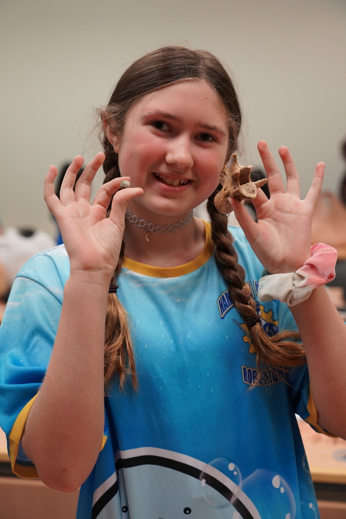 Skye holding a fossil