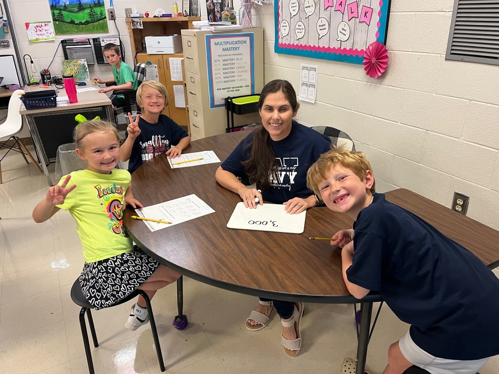 Students completing math problems.