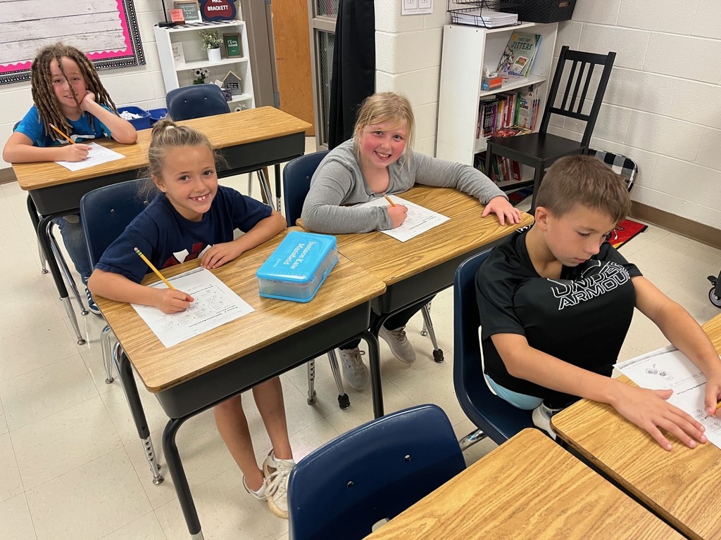 Students completing math problems.