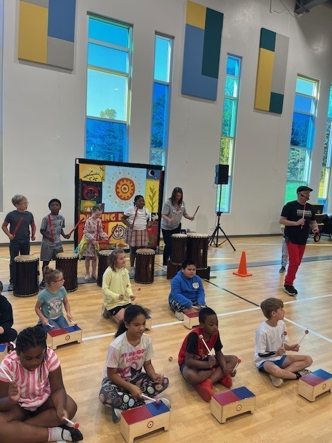 Students participating in the dancing drum program.