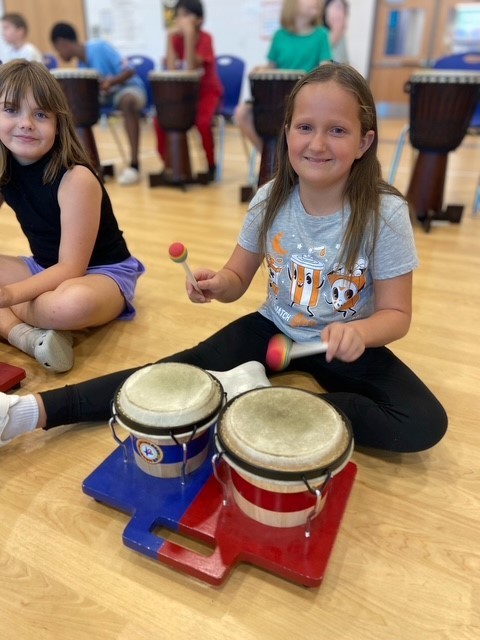Student playing drums.